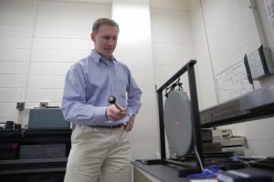 Matt Allen strikes a traditional East Asian gong in his lab and uses a laser to precisely measure the nonlinear vibrations associated with the multiple tones. He is working to compare those measurements with computer models in hopes that one day he will be able to account for nonlinear vibrations like these. The ability to properly account for nonlinearity would be useful for all sorts of industries. Photo: Stephanie Precourt